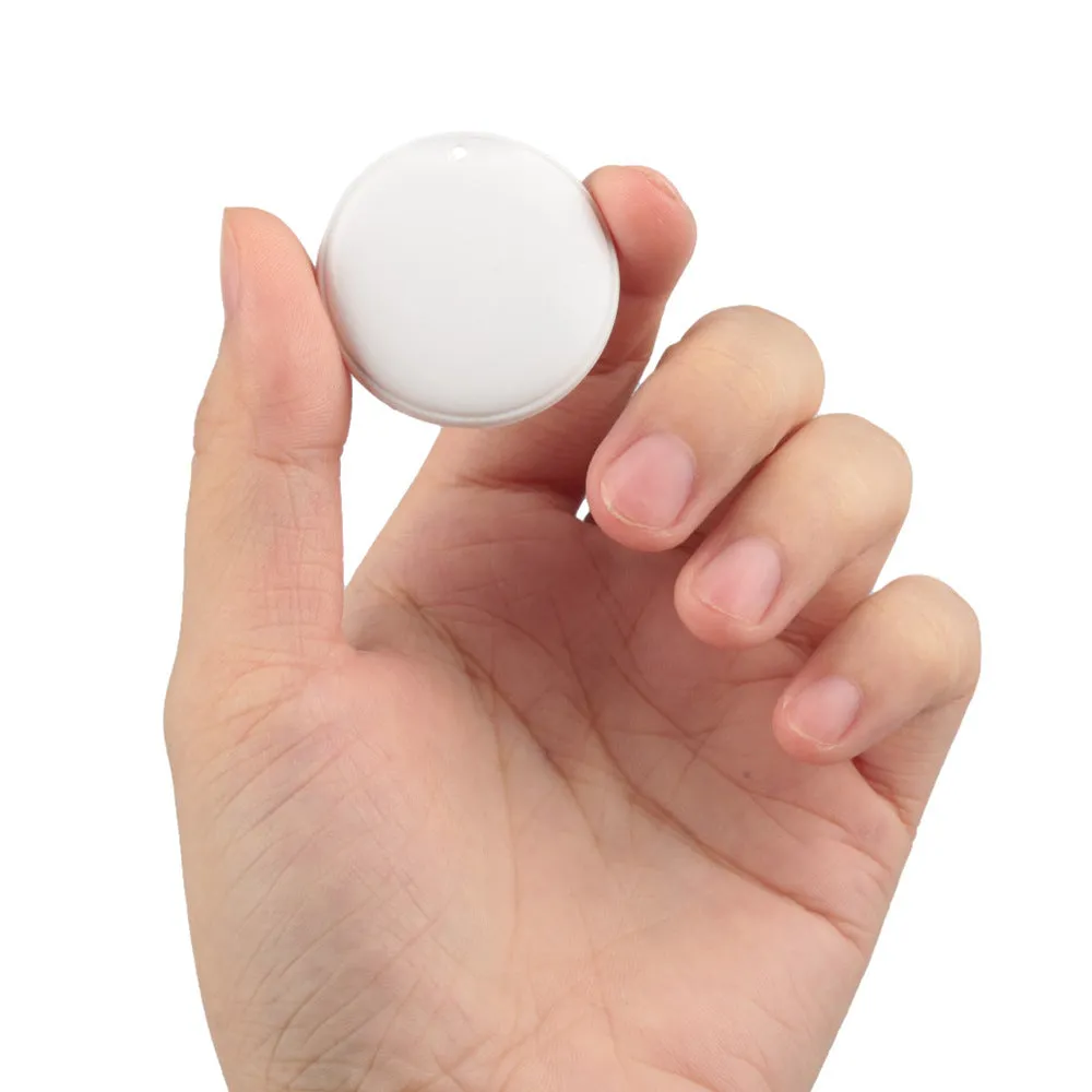 White and black GPS tracker for pets and keys with hanging rope attachment
