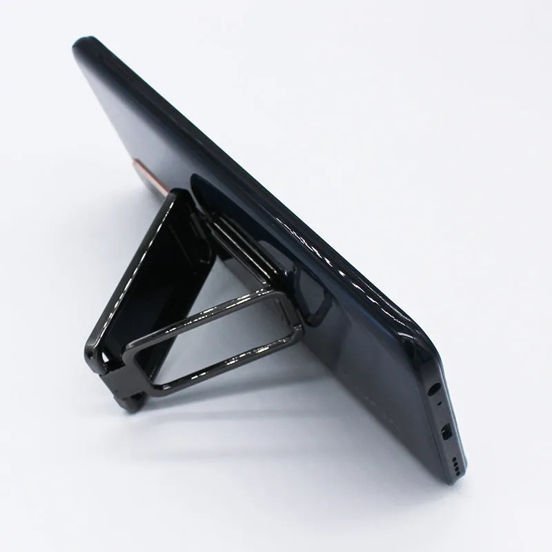 Foldable mobile phone holder with retractable ring buckle in zinc alloy, showing adjustable angle for devices