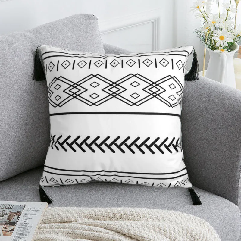 Bohemian national style throw pillow cushion cover in light grey on a sofa.