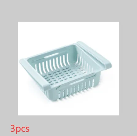 Blue telescopic refrigerator storage basket with adjustable width from 22cm to 34cm on a kitchen counter