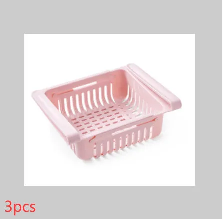 Blue telescopic refrigerator storage basket with adjustable width from 22cm to 34cm on a kitchen counter