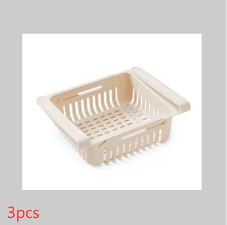 Blue telescopic refrigerator storage basket with adjustable width from 22cm to 34cm on a kitchen counter