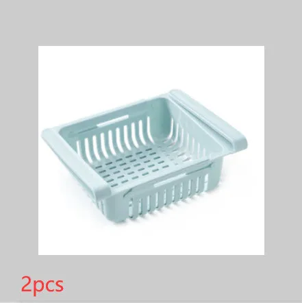 Blue telescopic refrigerator storage basket with adjustable width from 22cm to 34cm on a kitchen counter