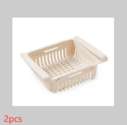 Blue telescopic refrigerator storage basket with adjustable width from 22cm to 34cm on a kitchen counter