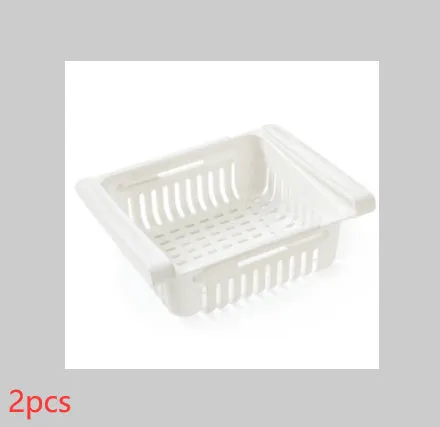 Blue telescopic refrigerator storage basket with adjustable width from 22cm to 34cm on a kitchen counter