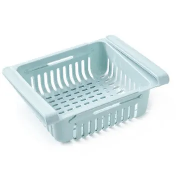 Blue telescopic refrigerator storage basket with adjustable width from 22cm to 34cm on a kitchen counter
