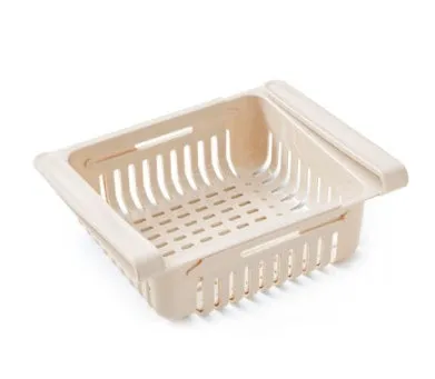 Blue telescopic refrigerator storage basket with adjustable width from 22cm to 34cm on a kitchen counter