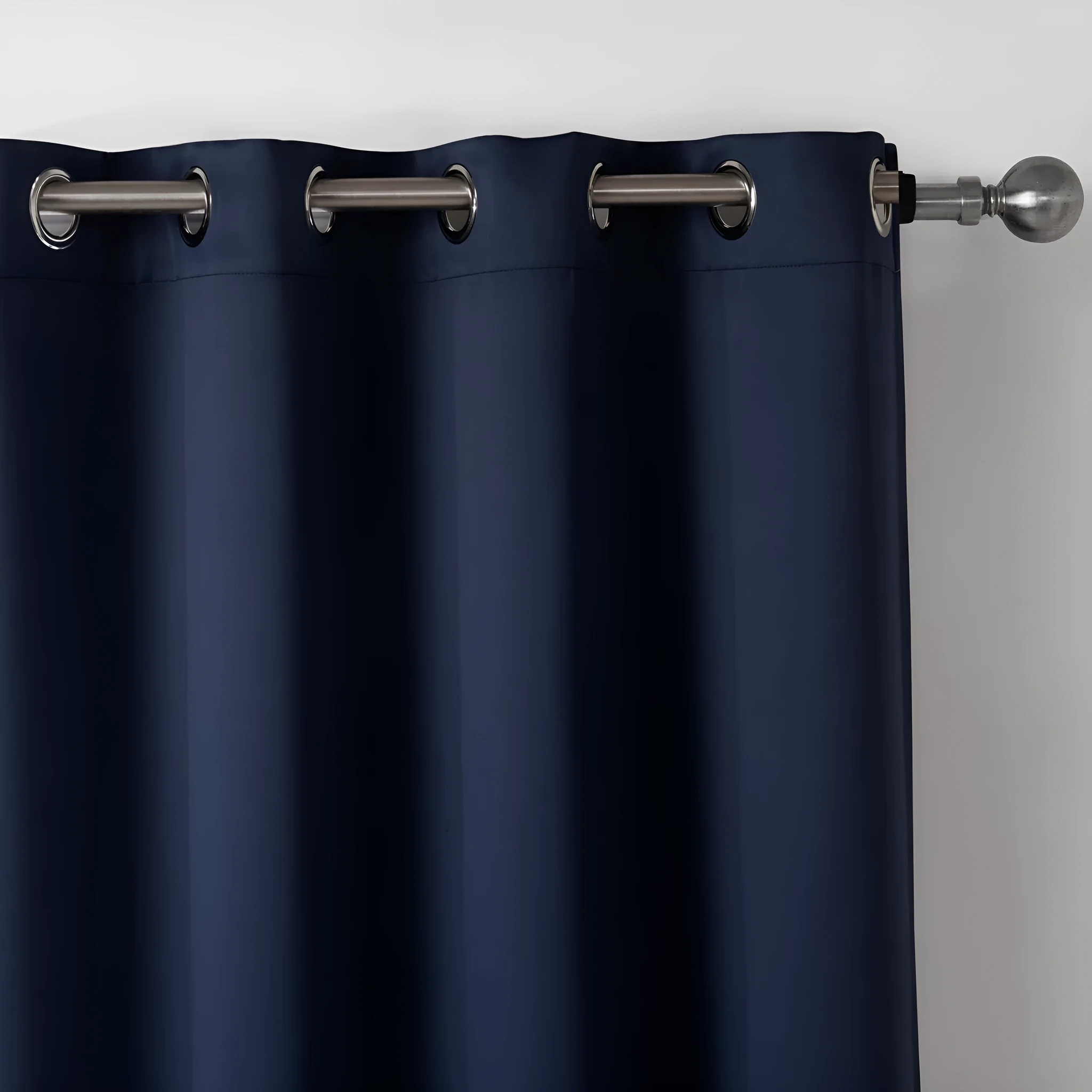 Dark navy blue modern blackout curtain made from shading cloth, hanging as a finished vertical panel.