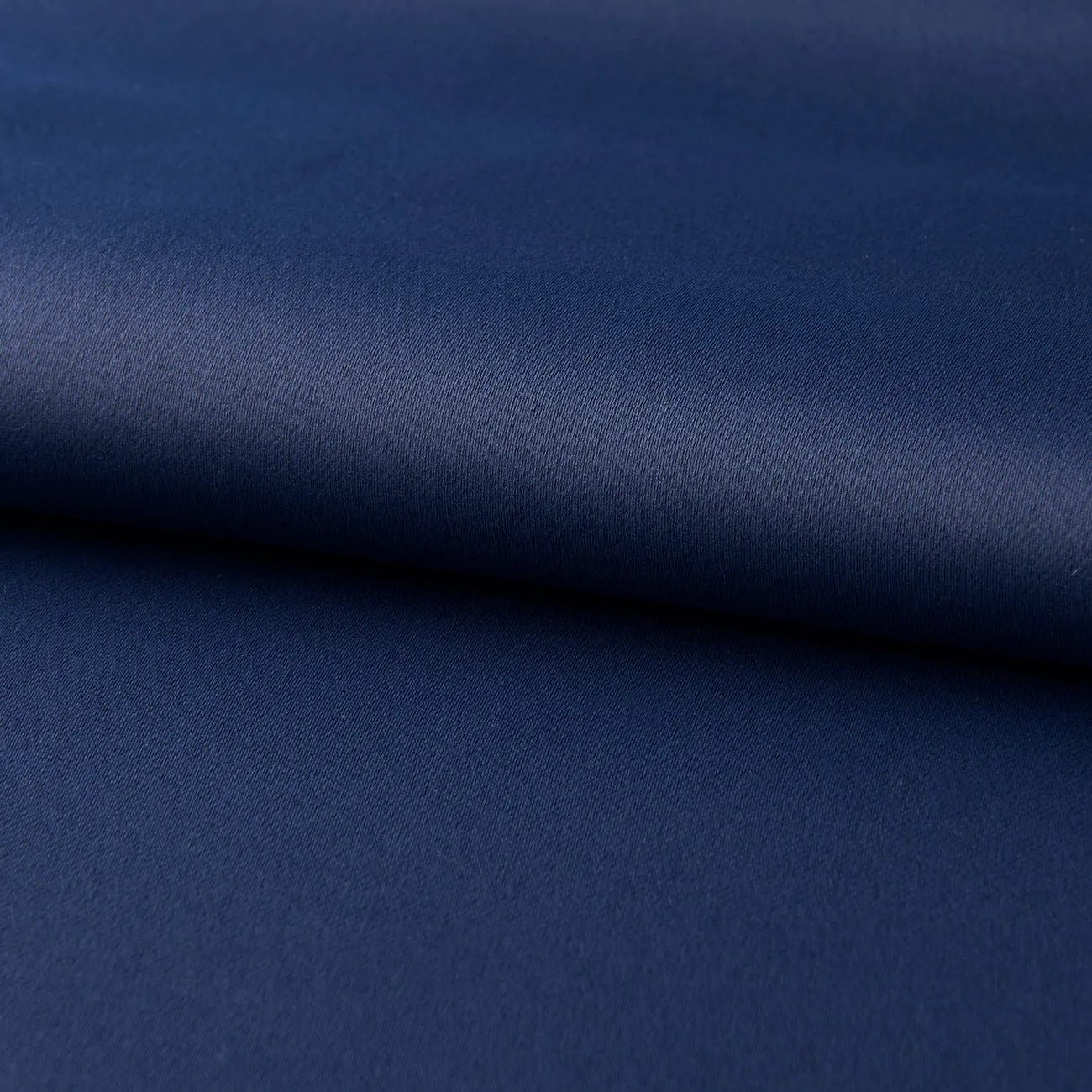 Dark navy blue modern blackout curtain made from shading cloth, hanging as a finished vertical panel.