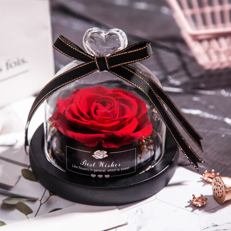 Eternal real rose with LED light inside a 13x13x12cm transparent glass dome, available in multiple colours