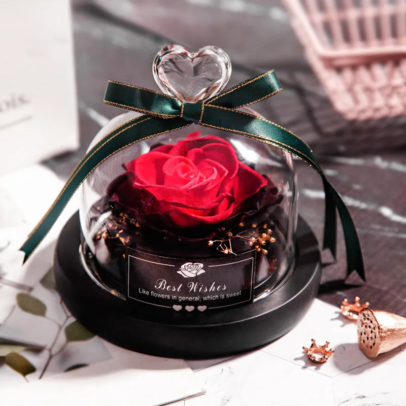 Eternal real rose with LED light inside a 13x13x12cm transparent glass dome, available in multiple colours