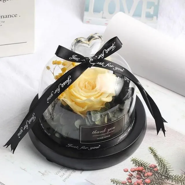 Eternal real rose with LED light inside a 13x13x12cm transparent glass dome, available in multiple colours