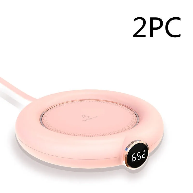 White USB cup warmer pad on desk with LED display showing temperature setting and mug on top