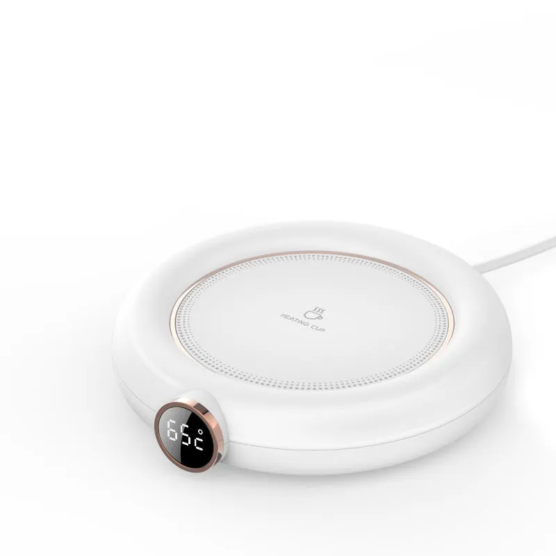 White USB cup warmer pad on desk with LED display showing temperature setting and mug on top