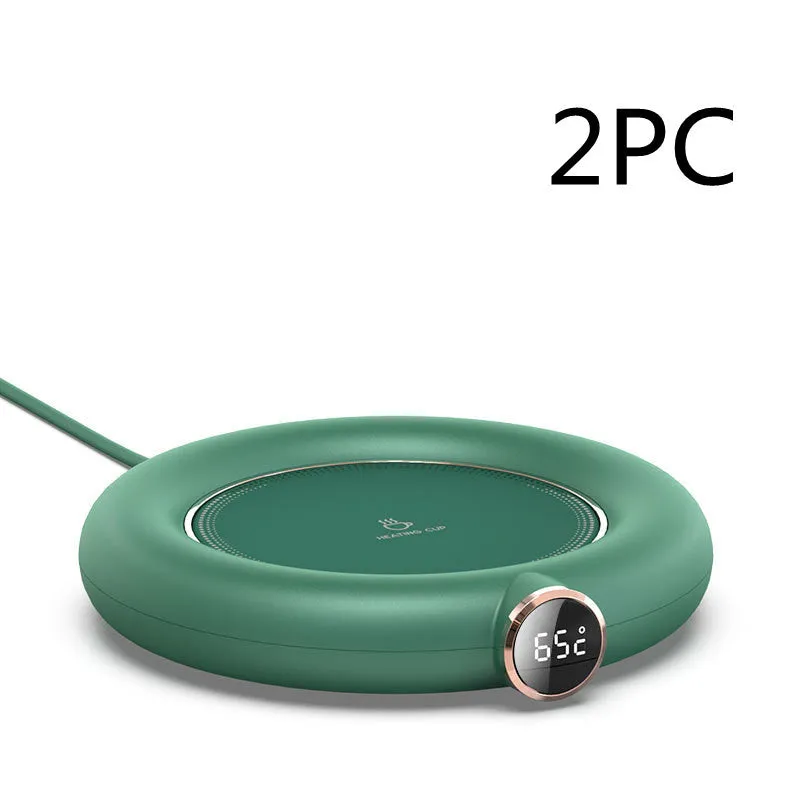 White USB cup warmer pad on desk with LED display showing temperature setting and mug on top