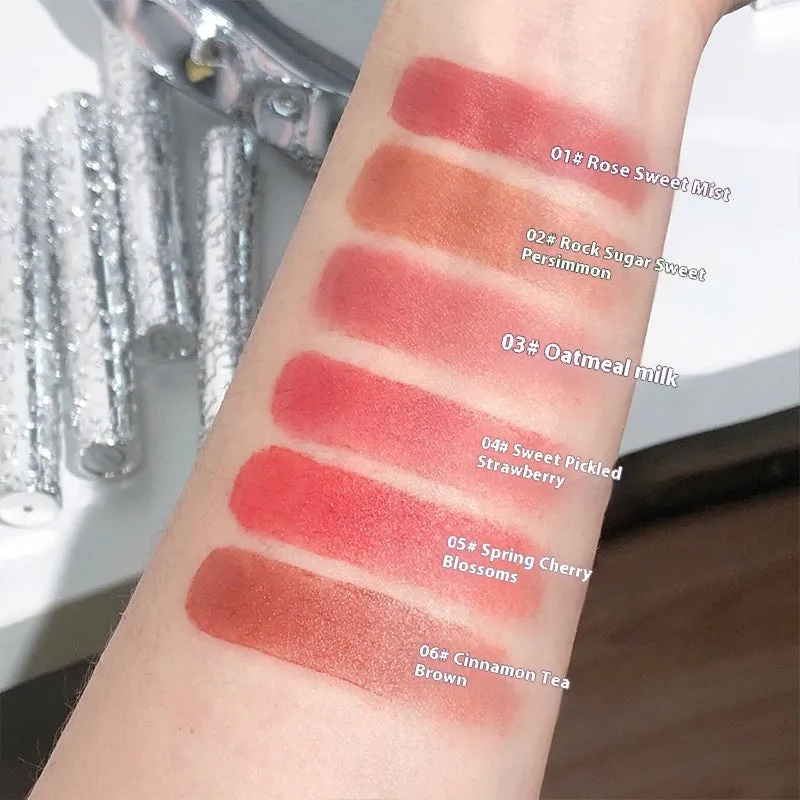 White matte case Velvet Mist Lip Mud Lipstick showing six colour shades