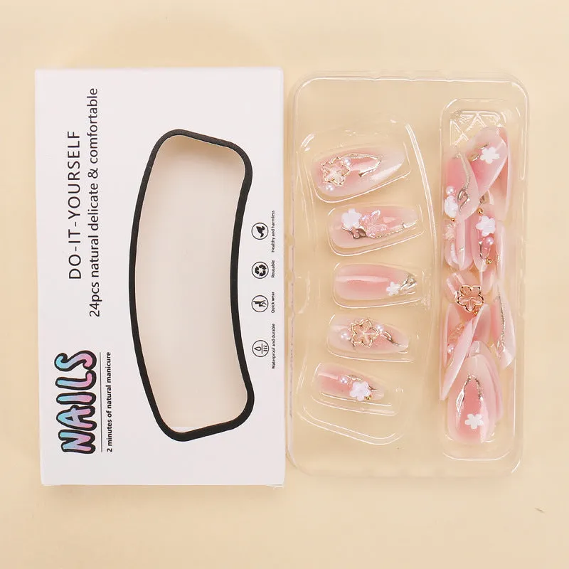 Gold silk butterfly nail tips with flower patterns and gradient gilding in medium drop shape
