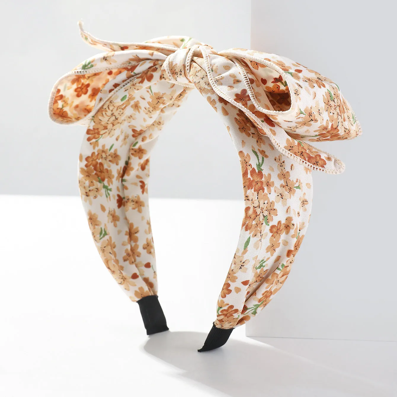 Handmade cloth hair bow with printed orchid and daisy flowers in pastoral style for women