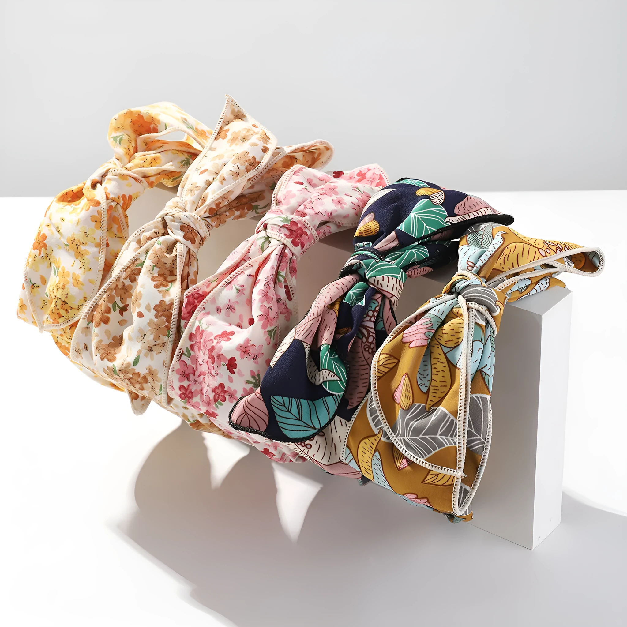 Handmade cloth hair bow with printed orchid and daisy flowers in pastoral style for women