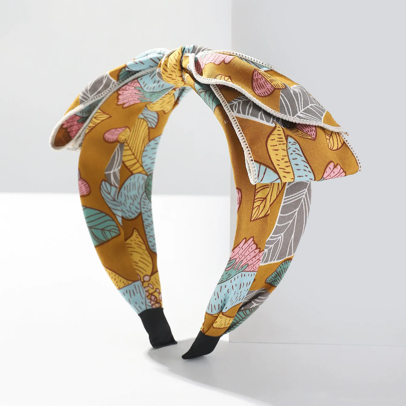 Handmade cloth hair bow with printed orchid and daisy flowers in pastoral style for women