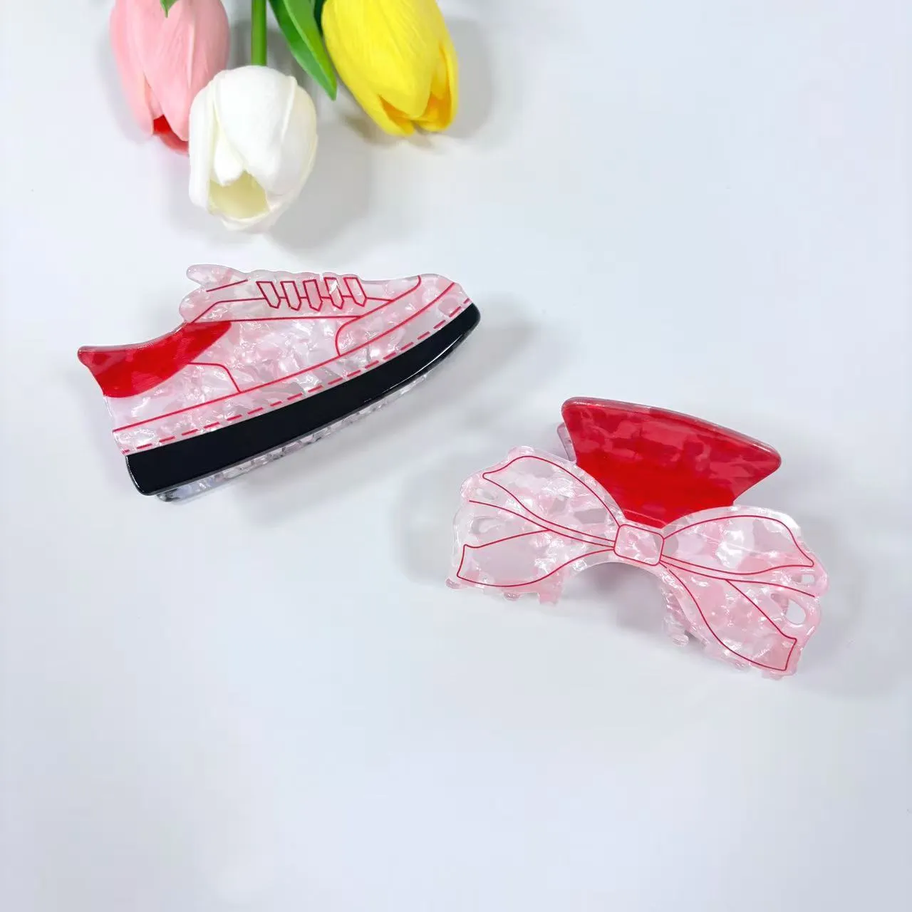 Acrylic bow tie hair grip in cream with glitter oil injection finish, 8cm long, for women