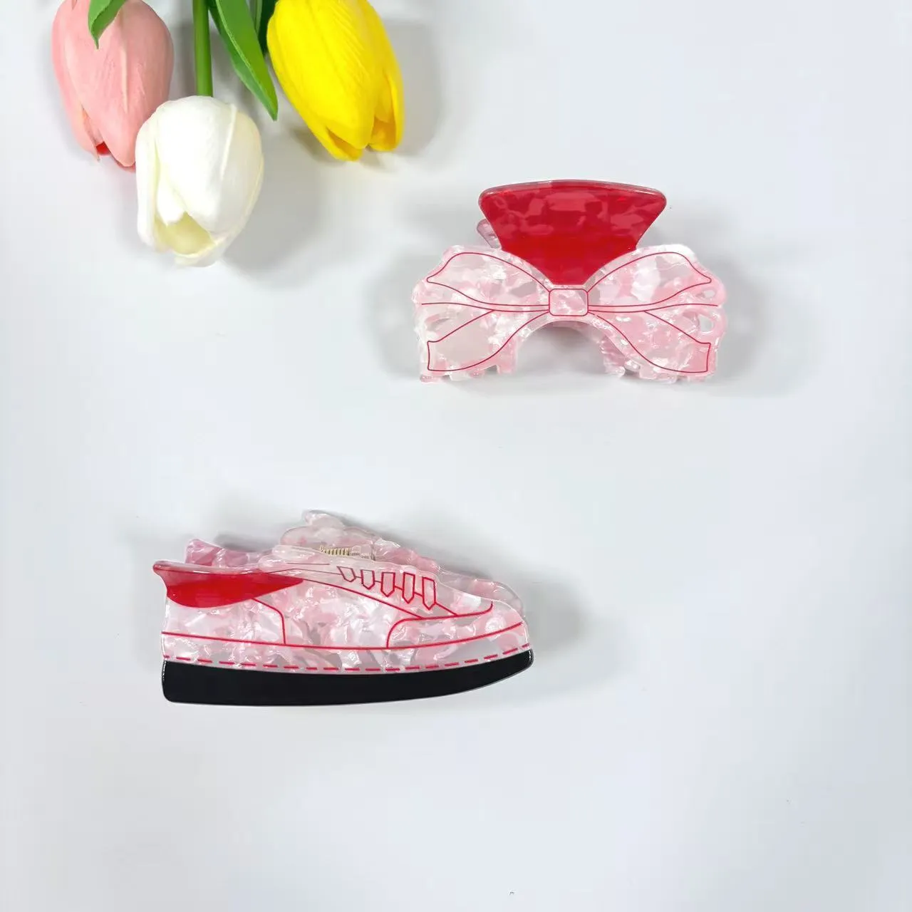 Acrylic bow tie hair grip in cream with glitter oil injection finish, 8cm long, for women