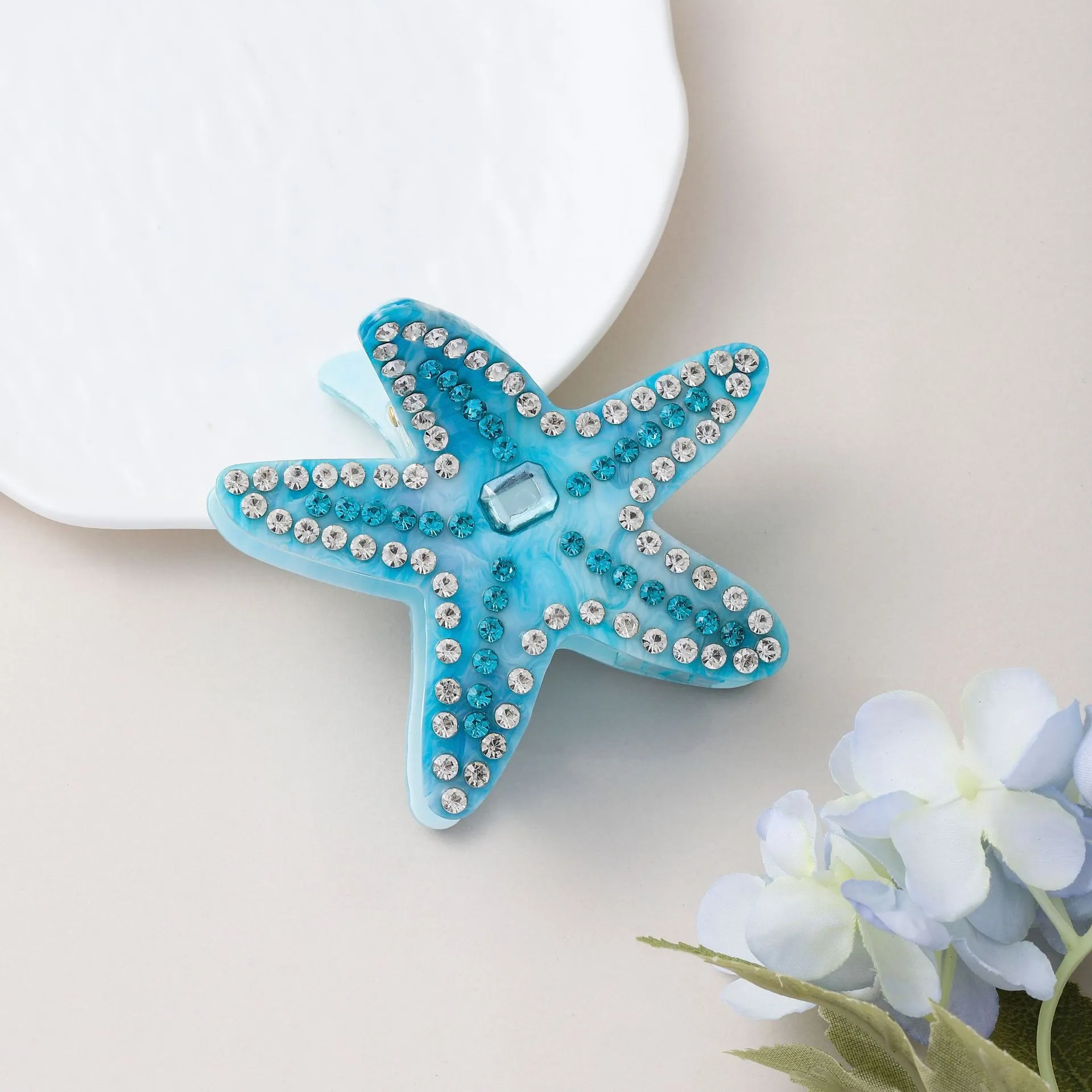 Acrylic starfish diamond encrusted hairpin in blue and pink colour options