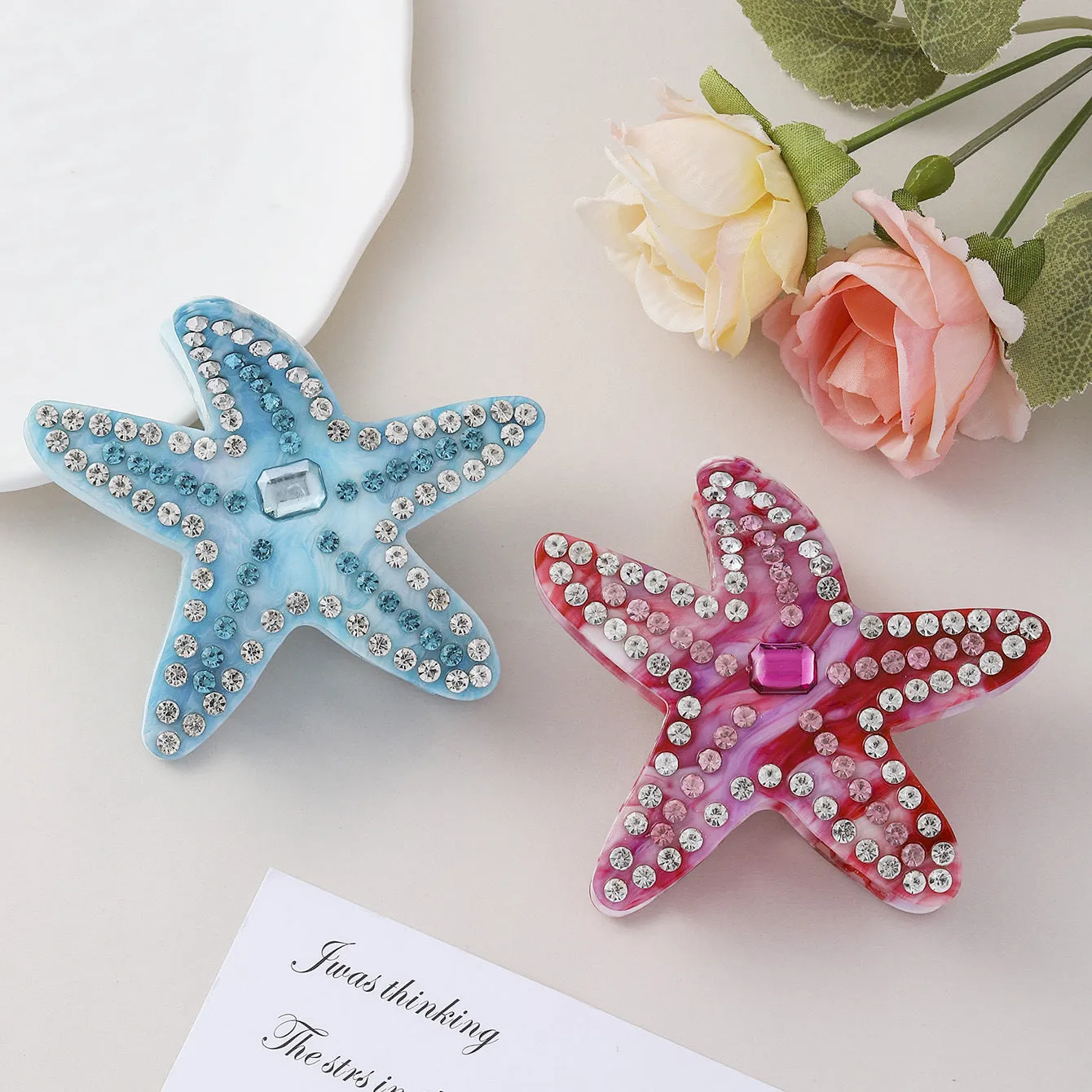Acrylic starfish diamond encrusted hairpin in blue and pink colour options