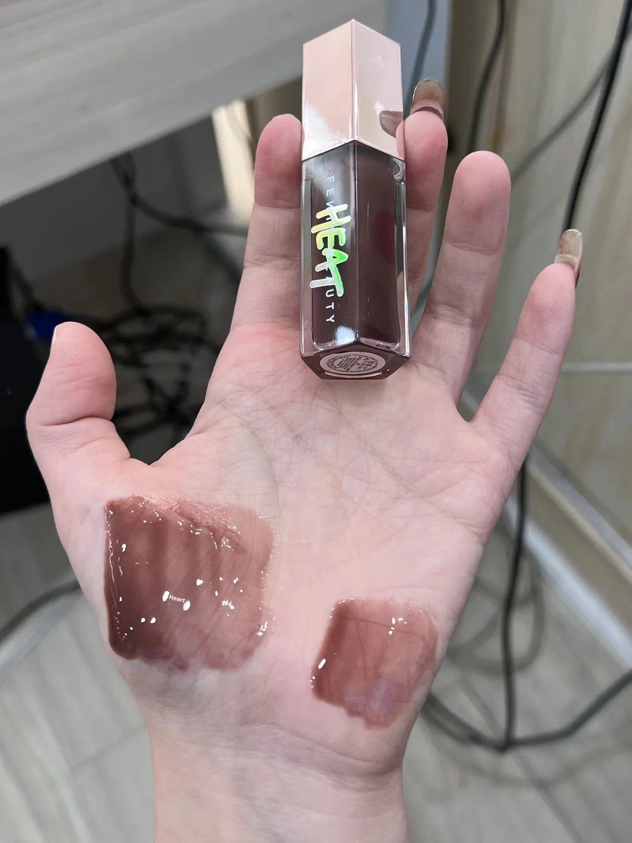Mirror Water Light Highlight Lip Lacquer lip gloss tube with wand applicator in streamer 01 Fenty Glow