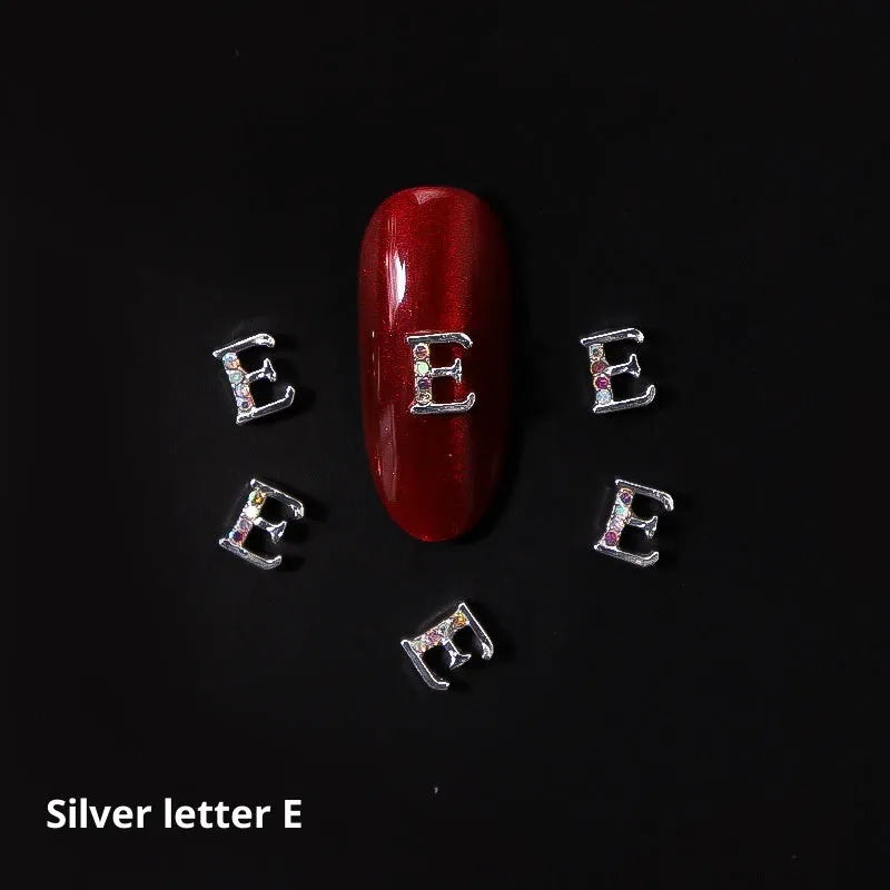 Gold alloy letter A nail ornament charm with crystal detail on a square chain base