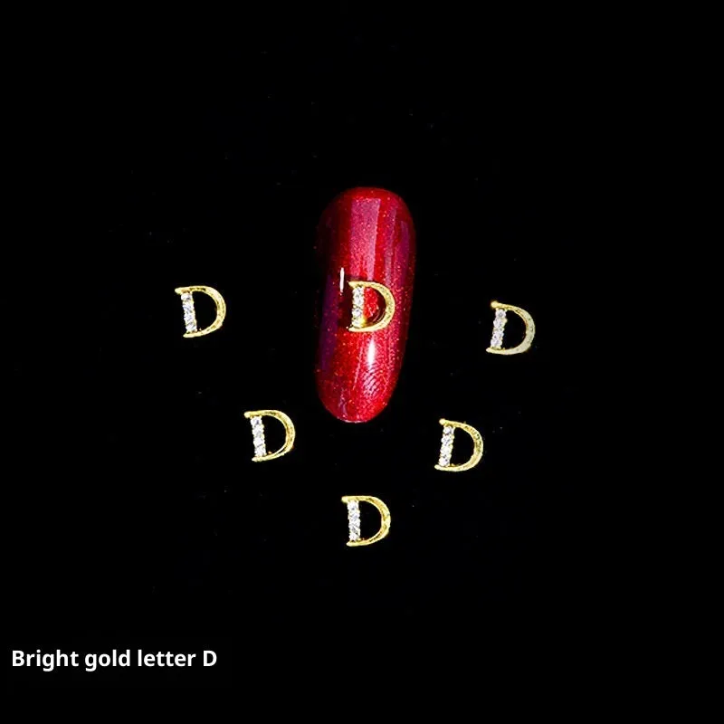 Gold alloy letter A nail ornament charm with crystal detail on a square chain base