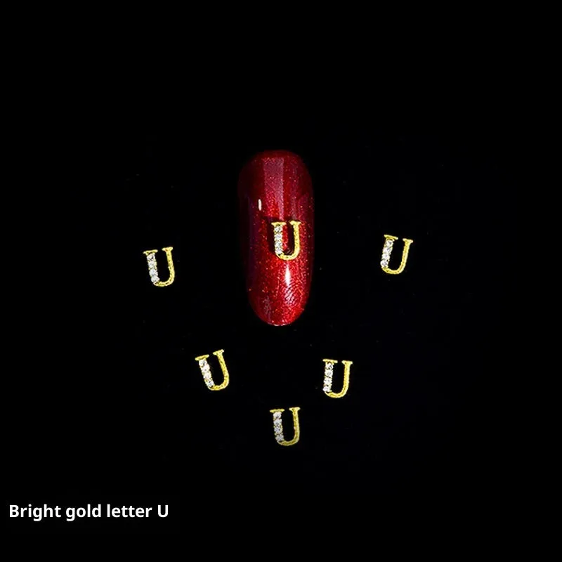 Gold alloy letter A nail ornament charm with crystal detail on a square chain base