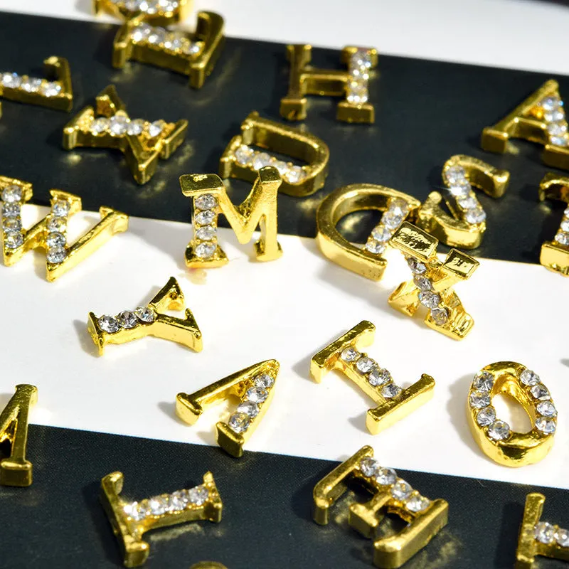 Gold alloy letter A nail ornament charm with crystal detail on a square chain base
