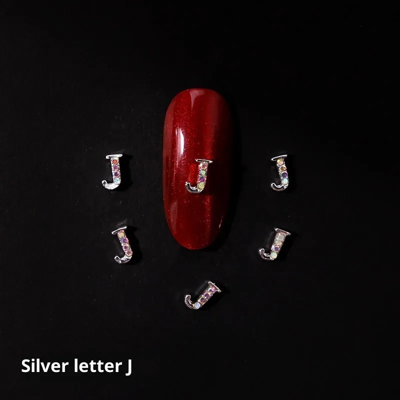 Gold alloy letter A nail ornament charm with crystal detail on a square chain base