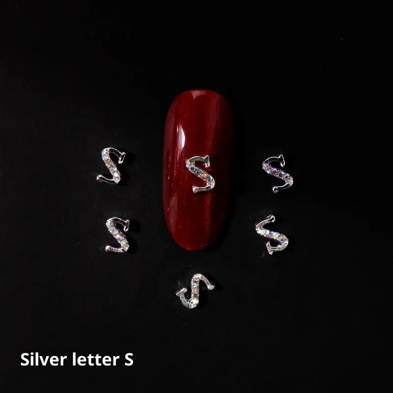 Gold alloy letter A nail ornament charm with crystal detail on a square chain base