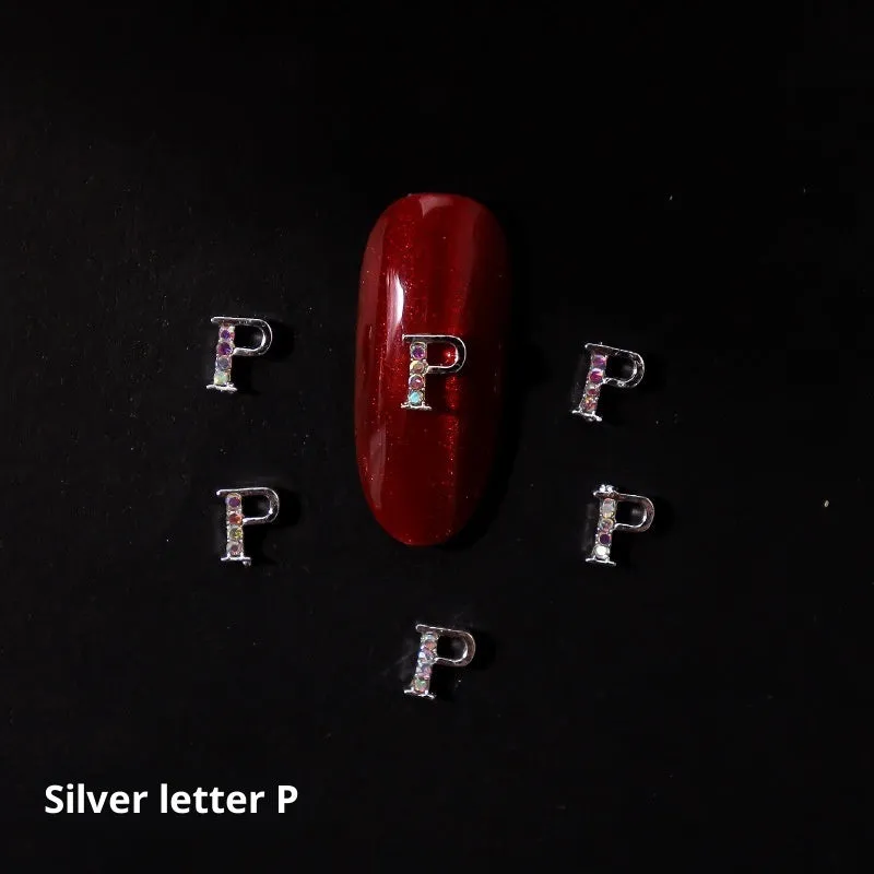 Gold alloy letter A nail ornament charm with crystal detail on a square chain base
