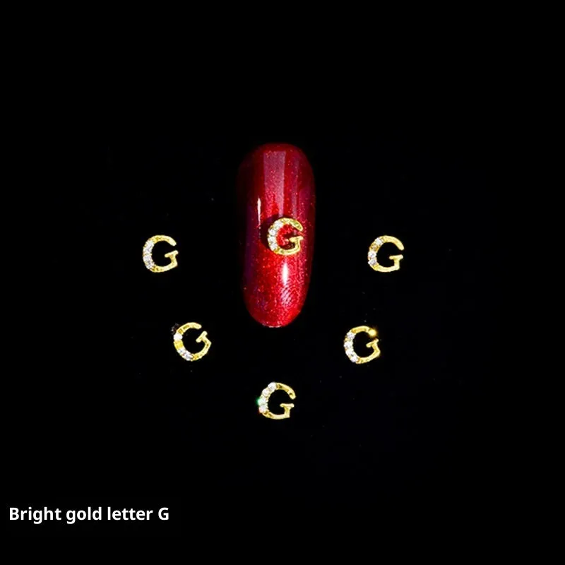 Gold alloy letter A nail ornament charm with crystal detail on a square chain base