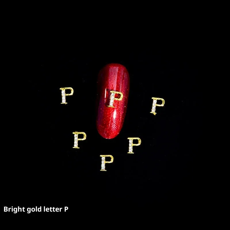 Gold alloy letter A nail ornament charm with crystal detail on a square chain base