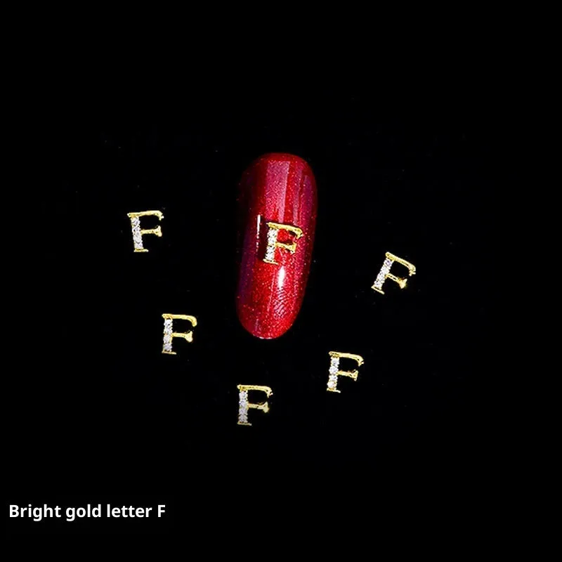 Gold alloy letter A nail ornament charm with crystal detail on a square chain base