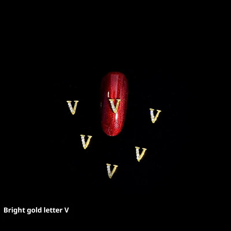 Gold alloy letter A nail ornament charm with crystal detail on a square chain base