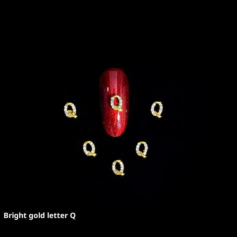 Gold alloy letter A nail ornament charm with crystal detail on a square chain base
