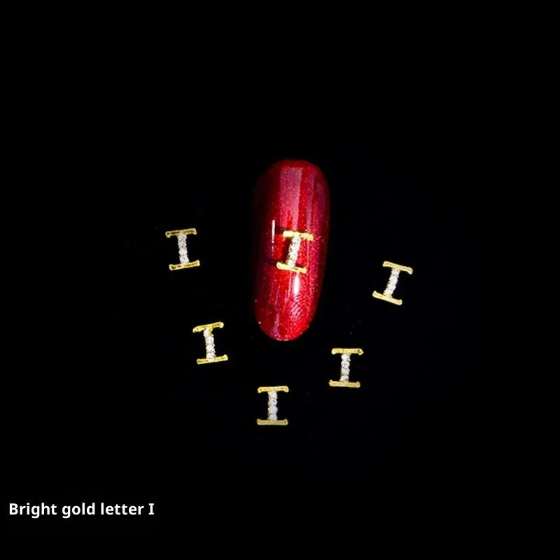 Gold alloy letter A nail ornament charm with crystal detail on a square chain base