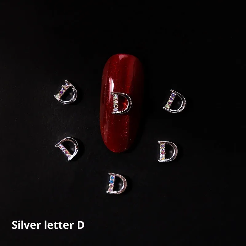 Gold alloy letter A nail ornament charm with crystal detail on a square chain base