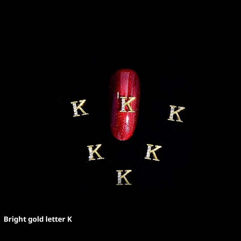 Gold alloy letter A nail ornament charm with crystal detail on a square chain base