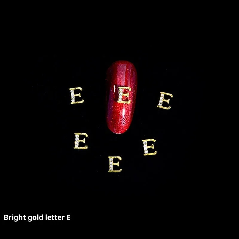 Gold alloy letter A nail ornament charm with crystal detail on a square chain base