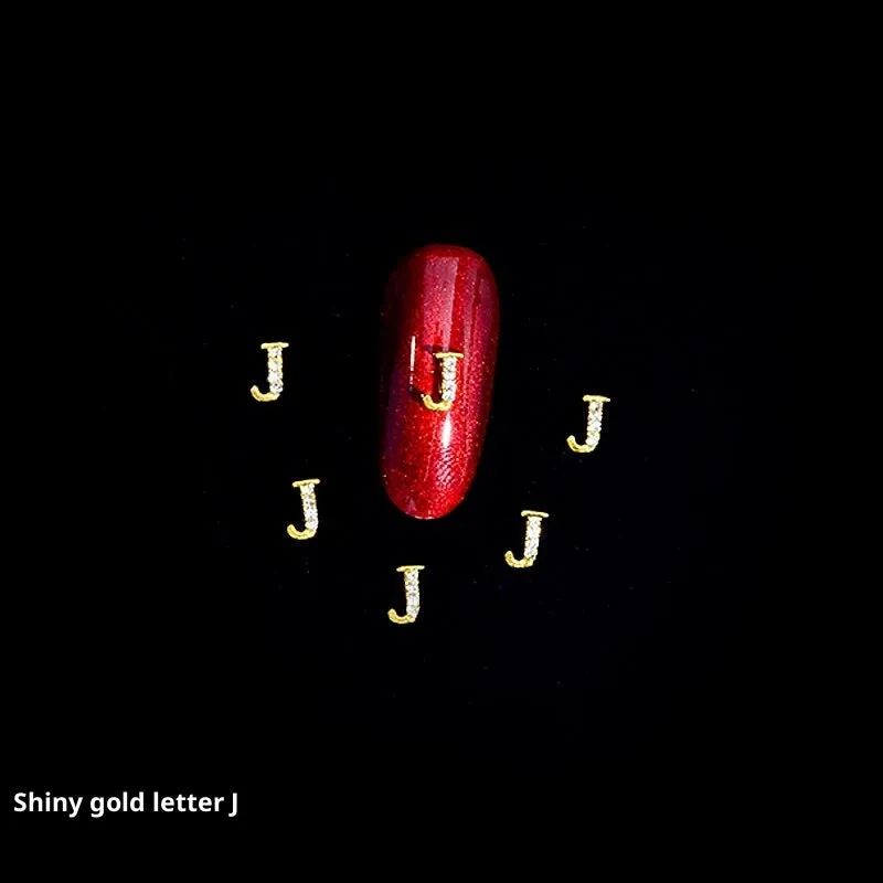Gold alloy letter A nail ornament charm with crystal detail on a square chain base