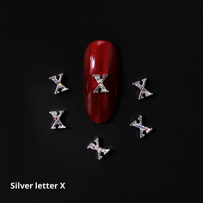 Gold alloy letter A nail ornament charm with crystal detail on a square chain base