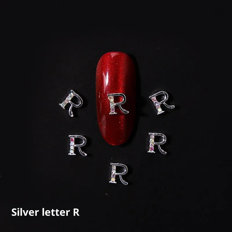 Gold alloy letter A nail ornament charm with crystal detail on a square chain base