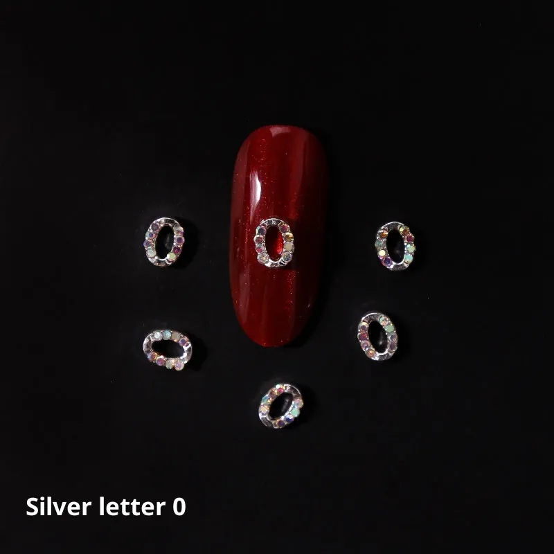 Gold alloy letter A nail ornament charm with crystal detail on a square chain base