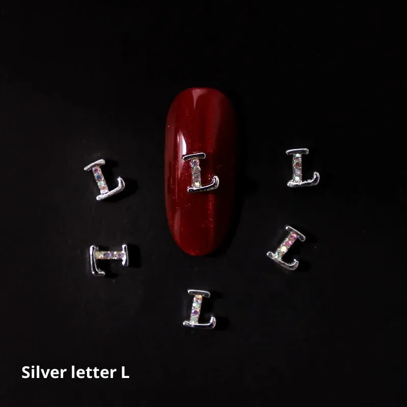 Gold alloy letter A nail ornament charm with crystal detail on a square chain base